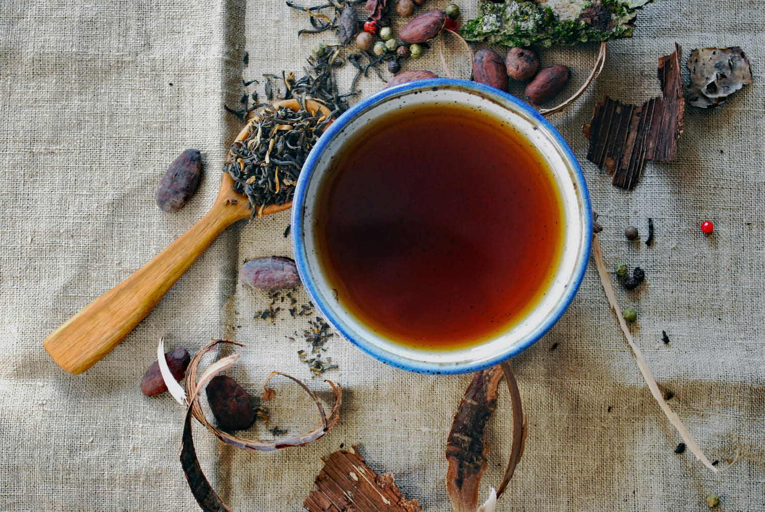 Black Tea Antioxidants and Loose Leaf Tea Tea antioxidants in a cup with loose leaf tea and natural ingredients