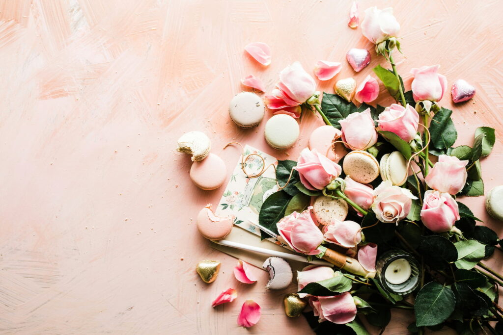 Pink roses and macarons arranged for a Mother’s Day tea celebration